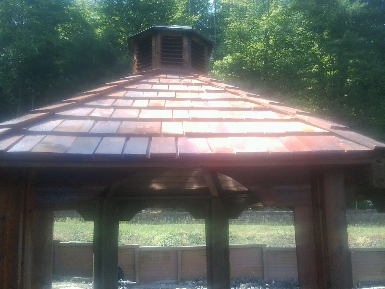 New cedar shake roof and cupola on a lakeside gazebo in Goodhue